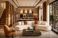 3 Bedroom House for Sale at Spectra Residence open-plan living room with curved white sofa marble coffee table and kitchen