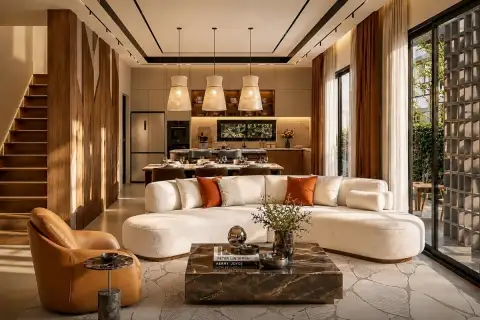 3 Bedroom House for Sale at Spectra Residence open-plan living room with curved white sofa marble coffee table and kitchen