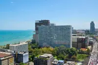 1 Bedroom Condo for Rent at EDGE Central Pattaya aerial view of building with sea and Central Pattaya mall in background