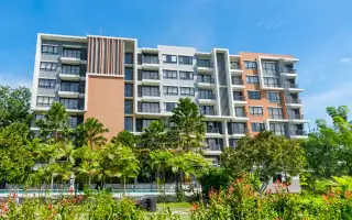 Cape Town Sriracha Condo Residence multi-story exterior facade with balconies and tropical palm landscaping