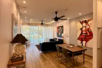 4 Bedroom Condo for Sale at Cetus Beachfront spacious living and dining room with bold artwork and pool view