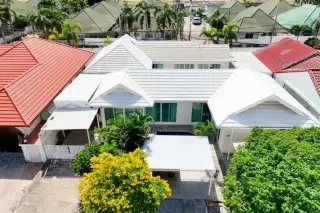 Siam Executive Estate aerial view of house with white gable roofs and private pool