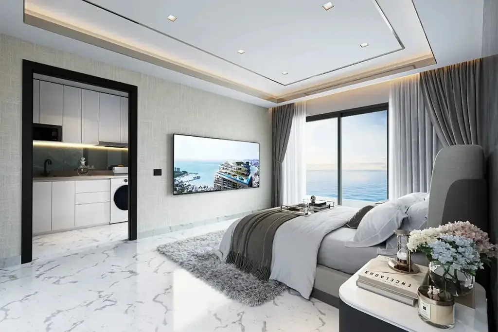 1 Bedroom Condo for Sale at Grand Solaire Noble living room with mirrored wall, white sofa and dining nook