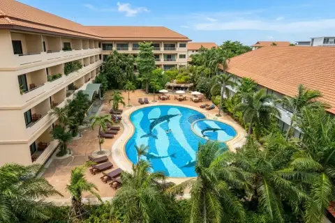 View Talay Residence 1&2 aerial view of freeform pool with dolphin mosaic tiles, sun loungers, and tropical gardens