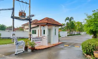 Siam Executive Estate gated entrance with security booth and zebra statue in Pattaya
