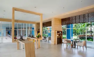 Lumpini Park Beach Jomtien lobby reception desk with wooden accents and garden view windows