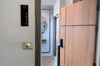 2 Bedroom Condo for Sale at The Twin Tower Jomtien Beach Pattaya unit 1340 entrance door with smart lock and hallway mirror