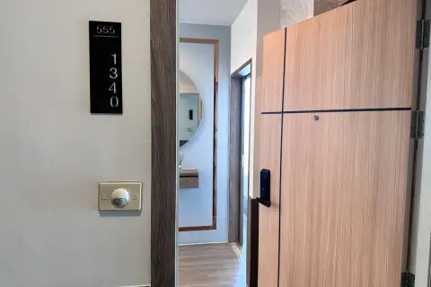 2 Bedroom Condo for Sale at The Twin Tower Jomtien Beach Pattaya unit 1340 entrance door with smart lock and hallway mirror