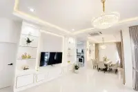 3 Bedroom House for Sale at Paradise Hill 2 elegant TV feature wall with glass shelves and gold accents beside dining area