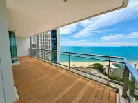 2 Bedroom Condo for Sale at Reflection Jomtien Beach wooden high-rise balcony with panoramic sea and beach view