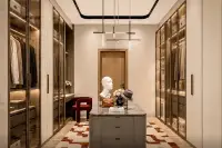 3 Bedroom House for Sale at Spectra Residence luxury walk-in closet with glass-front wardrobes and marble island unit