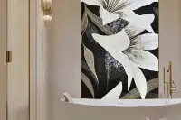 1 Bedroom Condo for Sale at The Riviera Palm Beach elegant bathroom with freestanding soaking tub and floral mosaic wall art