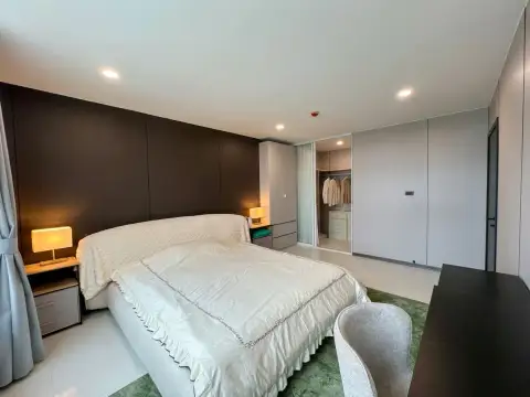 1 Bedroom Condo for Sale at The Ocean Pearl bedroom with upholstered bed and mirrored closet