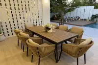 4 Bedroom House for Sale at AVANI Pool Villa covered outdoor dining area with 8-seat rattan chairs and pool deck beyond
