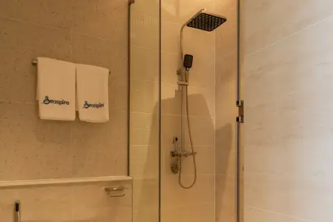 Studio Condo for Sale at Seaspire Jomtien glass-enclosed rain shower with dual showerhead and Seaspire branded towels