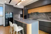 3 Bedroom House for Sale at Areeya Villa: Living area wall with marble-patterned panel, built-in shelves, and wood accents.