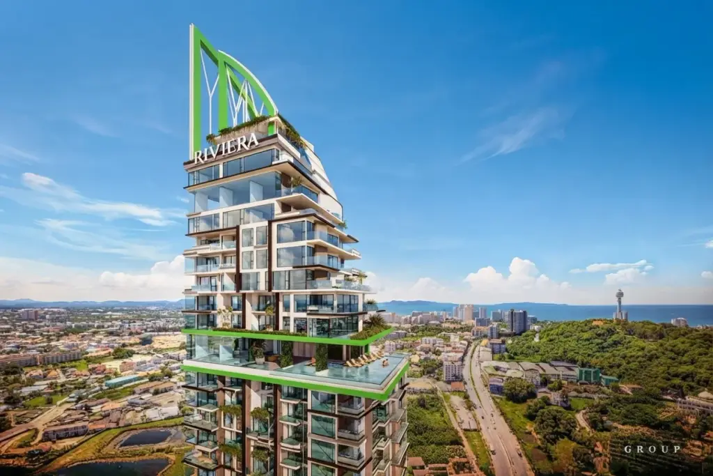 Riviera California modern high-rise condo building with green accents, balconies, and a pool, overlooking Pattaya city and ocean.