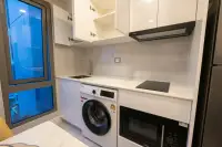 1 Bedroom Condo for Rent at Copacabana Beach Jomtien compact kitchenette with washing machine and microwave