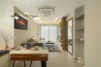 1 Bedroom Condo for Sale at Zensiri Estates and Residences open-plan living and dining area with gold pendant light and bedroom doorway