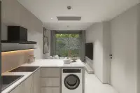 1 Bedroom Condo for Sale at Celine Wongamat modern kitchen with wood cabinets, white countertop, induction hob and washing machine