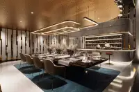 3 Bedroom Condo for Sale at Grand Solaire Noble bedroom with large TV and panoramic Pattaya cityscape view