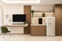 Studio Condo for Sale at Siam Oriental Beach: Compact kitchen with a retro fridge, sink, cooktop, and a TV on a desk.