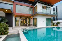4 Bedroom House for Sale & Rent at M Mountain Village exterior view of modern two-story house with pool