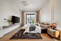4 Bedroom House for Sale at Chieftain master bedroom with king bed, wood floors, TV unit and balcony door