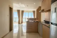 3 Bedroom Condo for Sale at Whale Marina kitchen and dining area with wooden cabinetry, island counter and balcony sea view
