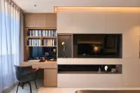 1 Bedroom Condo for Sale at Sea Sky By Sand built-in study desk with bookshelf, wall-mounted TV unit, and open shelving with decorative sculptures