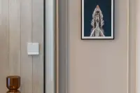 1 Bedroom Condo for Sale at Aquarous Jomtien Pattaya interior wall detail with framed aerial boat artwork and amber glass decor