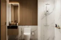 2 Bedroom Condo for Sale at Siam Oriental Beach: stylish bathroom with marble-effect tiles, floating vanity, toilet, and a walk-in shower.
