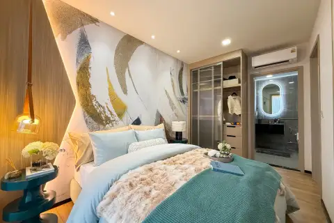 2 Bedroom Condo for Sale at Aquarous Jomtien Pattaya bedroom with built-in wardrobe, en-suite glass shower and accent lighting