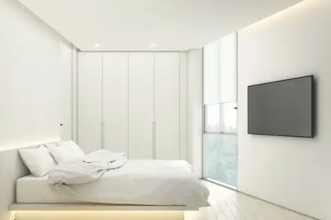 2 Bedroom Condo for Sale at Secret Garden Condominium, bedroom with built-in wardrobes, large window, and wall-mounted TV.