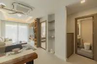 1 Bedroom Condo for Sale at Zensiri Estates and Residences hallway view showing living area, bedroom entrance, and modern bathroom