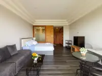 Studio Condo for Sale at Jomtien Condotel & Village exterior facade showing multiple balconies and parking area