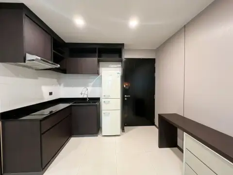 1 Bedroom Condo for Sale at The Ocean Pearl living area with sectional sofa and open kitchen
