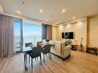2 Bedroom Condo for Sale at Baan Plai Haad living and dining area with sea view balcony