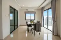 3 Bedroom House for Sale at Patta Define dining area with marble table and sliding glass doors
