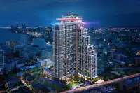 4 Bedroom Condo for Sale at Grand Solaire Noble bedroom with marble accent wall and evening city view