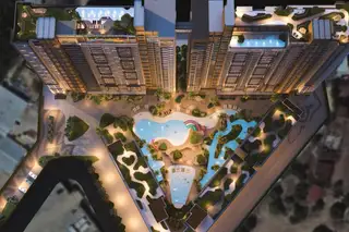 Seven Seas Le Carnival top-down aerial view of the condo complex, showing multiple pools, water slides, and lush landscaping.