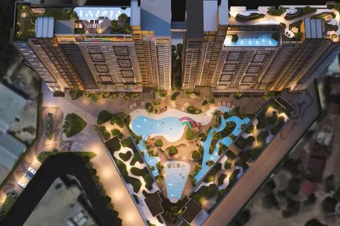 Seven Seas Le Carnival top-down aerial view of the condo complex, showing multiple pools, water slides, and lush landscaping.