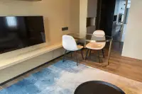 2 Bedroom Condo for Rent at Beverly Mountain Bay Pattaya dining area with glass table and TV console