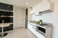 1 Bedroom Condo for Sale at The Vision bedroom with large windows offering city views and a double bed.
