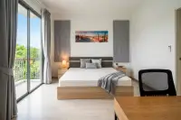 3 Bedroom House for Sale at Patta Define bedroom with wooden bed frame and balcony access