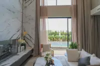 4 Bedroom House for Sale at Highbury Hill Pool Villas Pattaya bright living room with marble feature wall and pool view