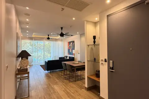 4 Bedroom Condo for Sale at Cetus Beachfront open-plan interior view from entrance door toward living area and balcony