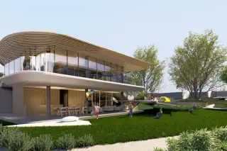 Solava Pattaya clubhouse exterior with floating canopy roof open living area and families relaxing on green lawn