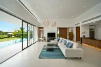 3 Bedroom House for Sale at Sunplay Bangsaray open-plan living room with pool view and kitchen area