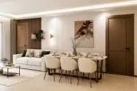 3 Bedroom Condo for Sale at Siam Oriental Beach, dining area with modern table, chairs, and sofa.